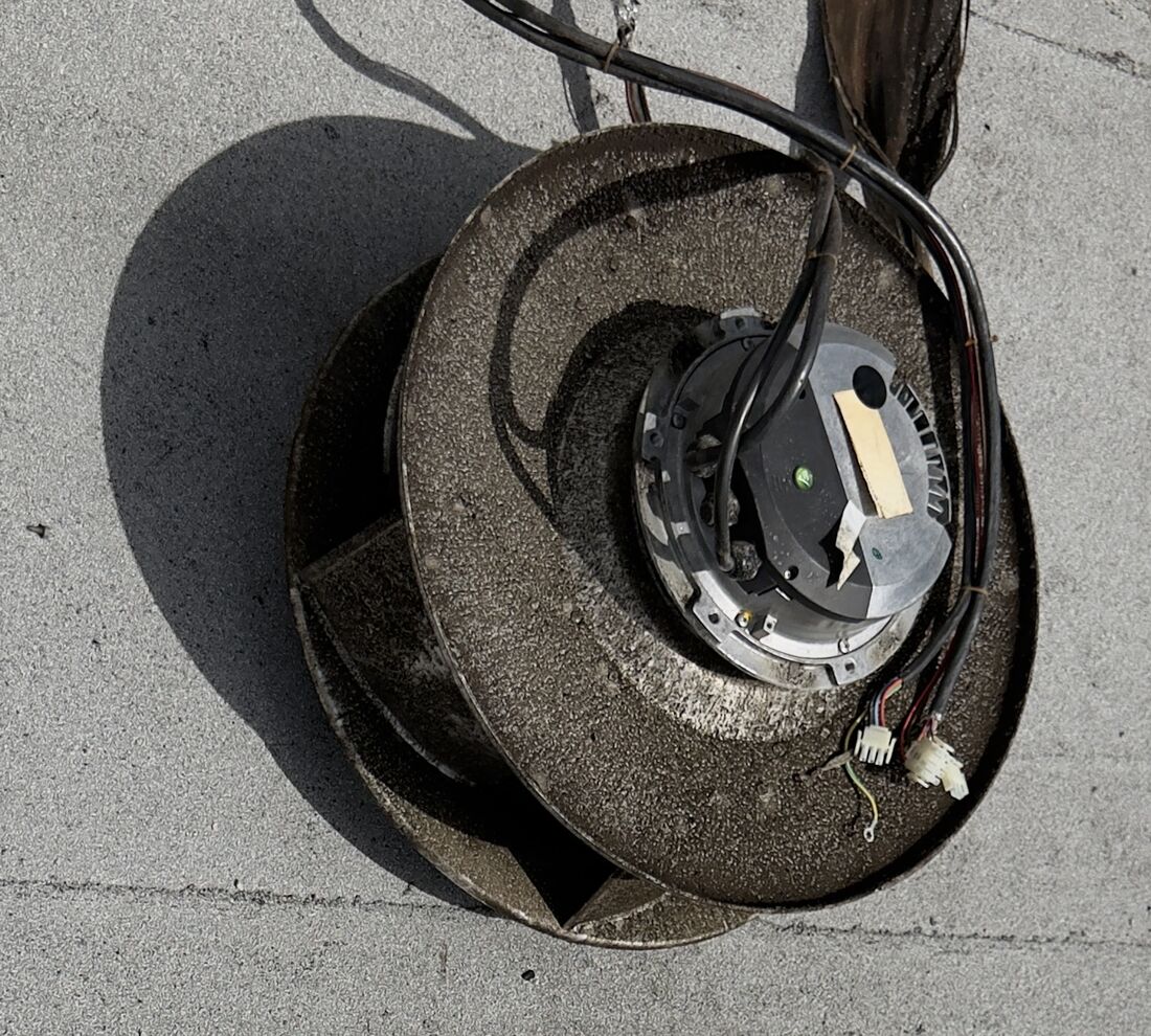 Corroded old rooftop blower wheel removed from the unit