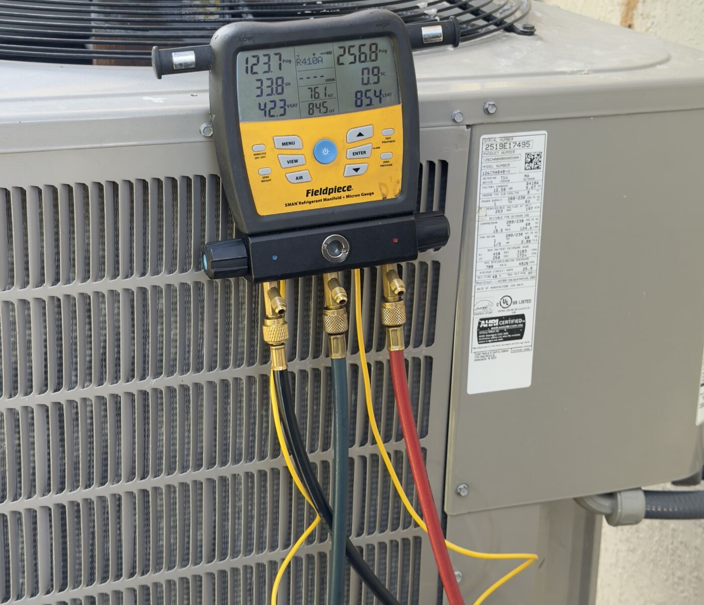 Digital refrigerant gauges connected to a condenser