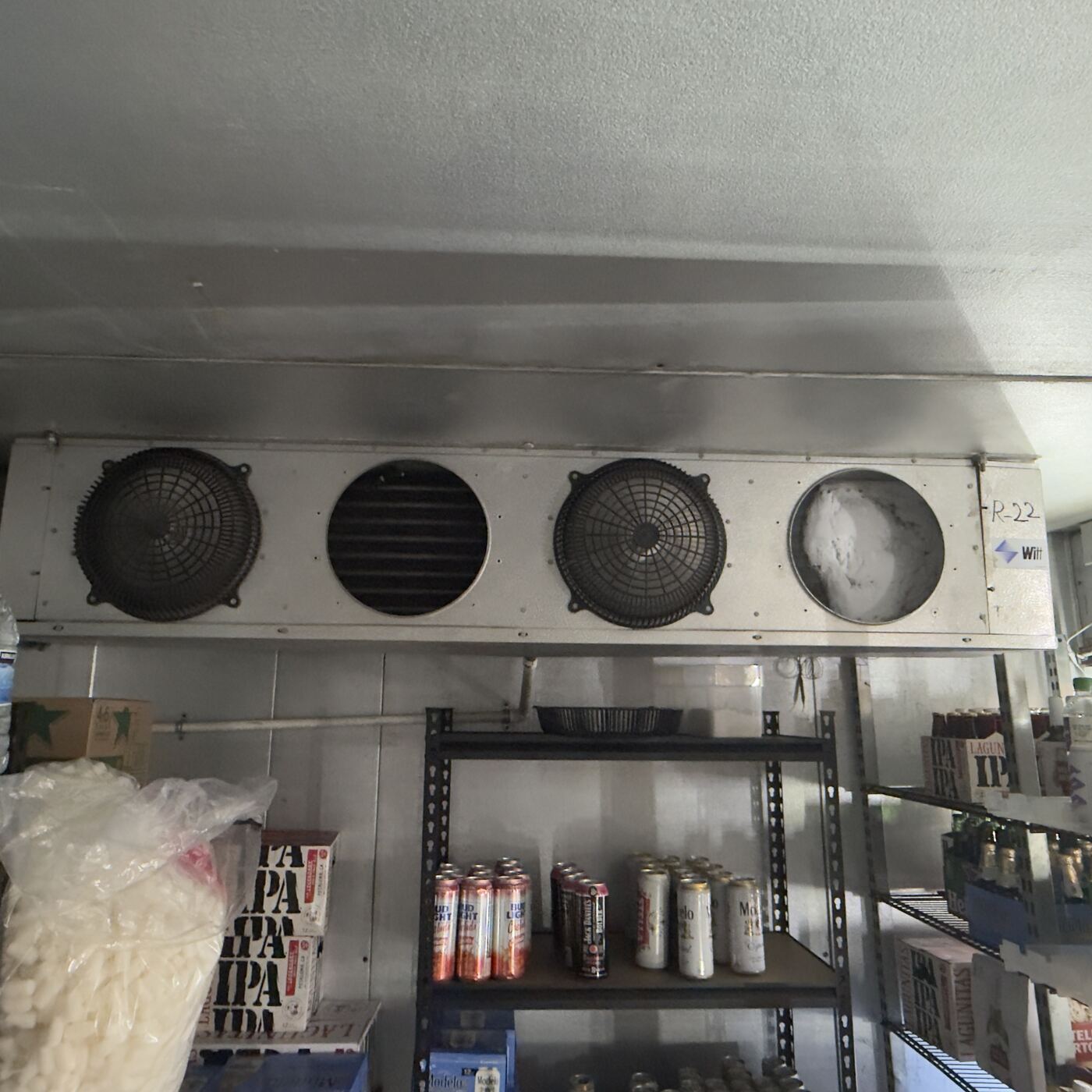 Walk-in cooler evaporator unit in a commercial store